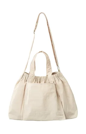 Crossbody sports bag with handle, side pockets and elastic